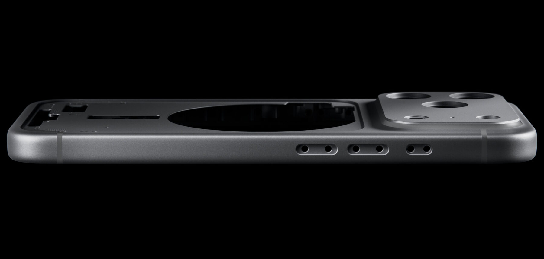 Macro study: the heat-forged aluminum unibody of iPhone 17 Pro, edge-lit in darkness