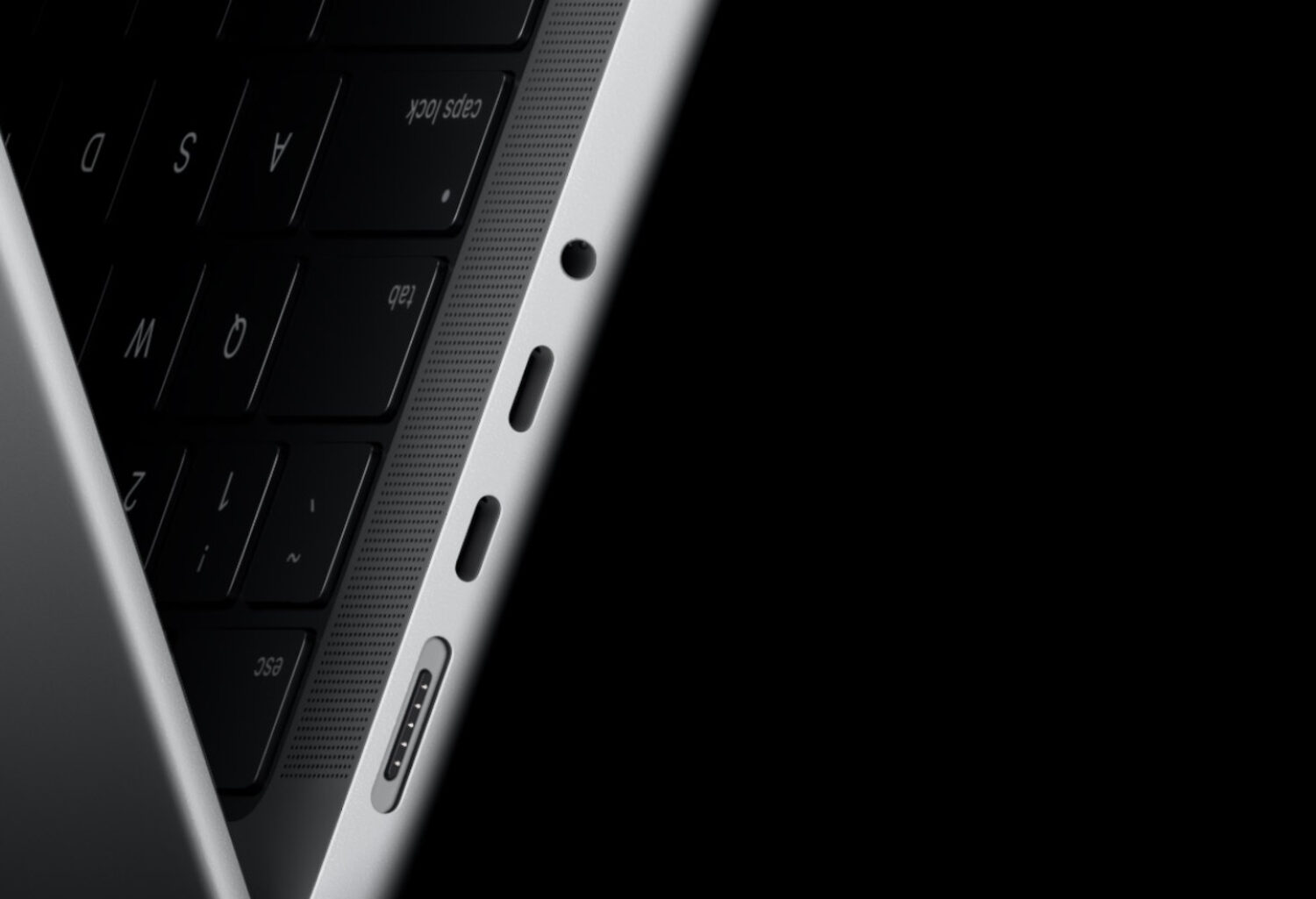 Macro study: Thunderbolt ports and speaker grille machined into the edge of MacBook Pro